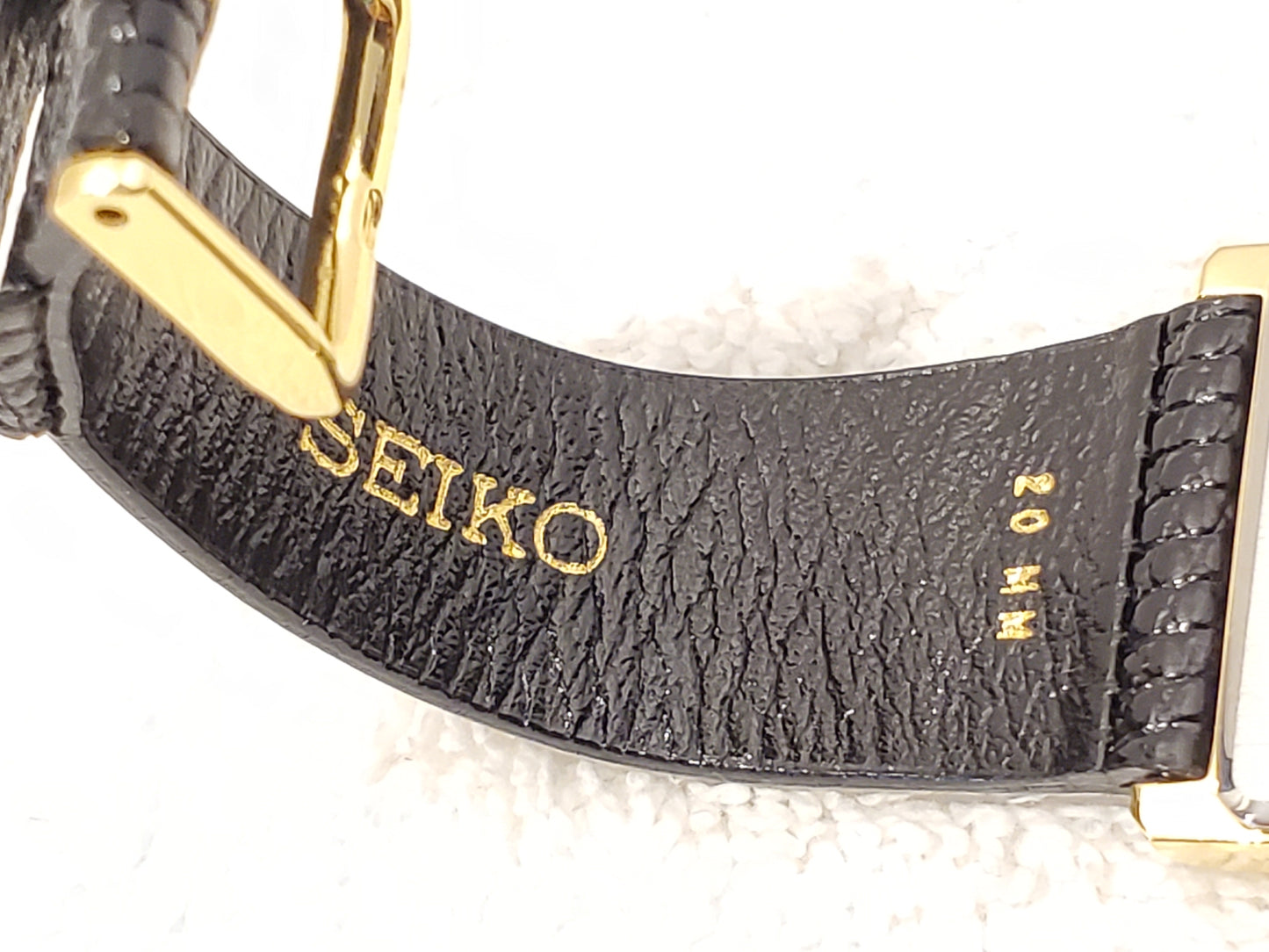 Vintage 1990's Seiko Women's Tank Quartz Watch One Jewel Black Dial Calfskin Strap Gold Tone