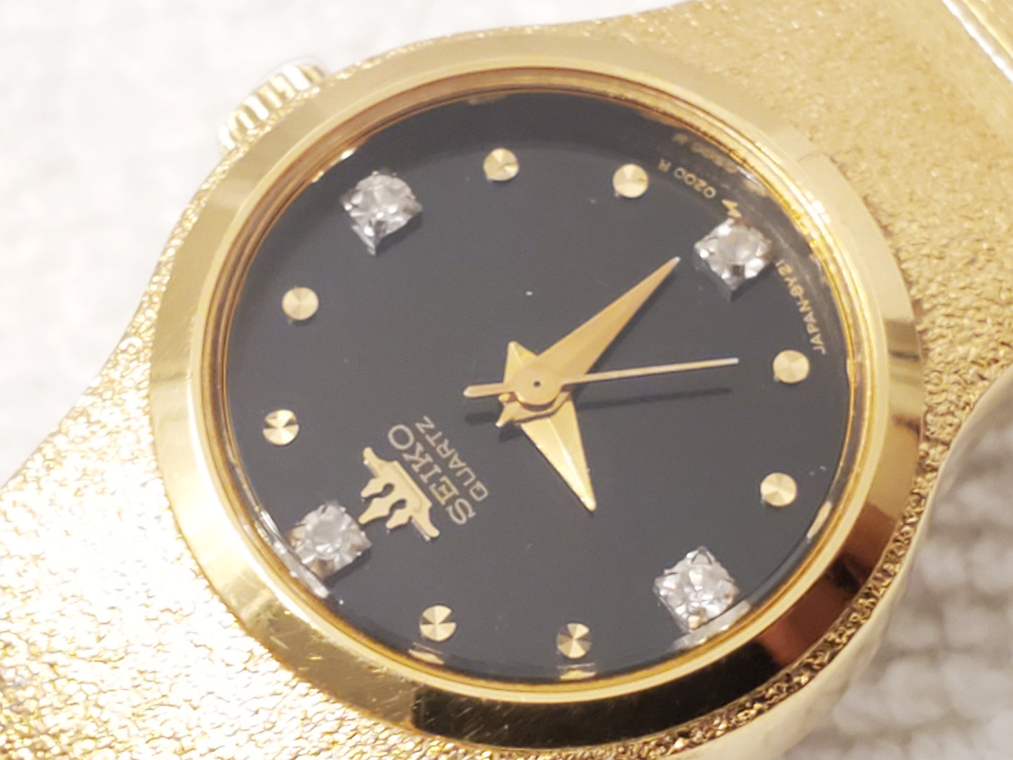 Vintage Seiko Womens Gold Tone Watch Black Dial Four Diamonds S Steel Base Metal