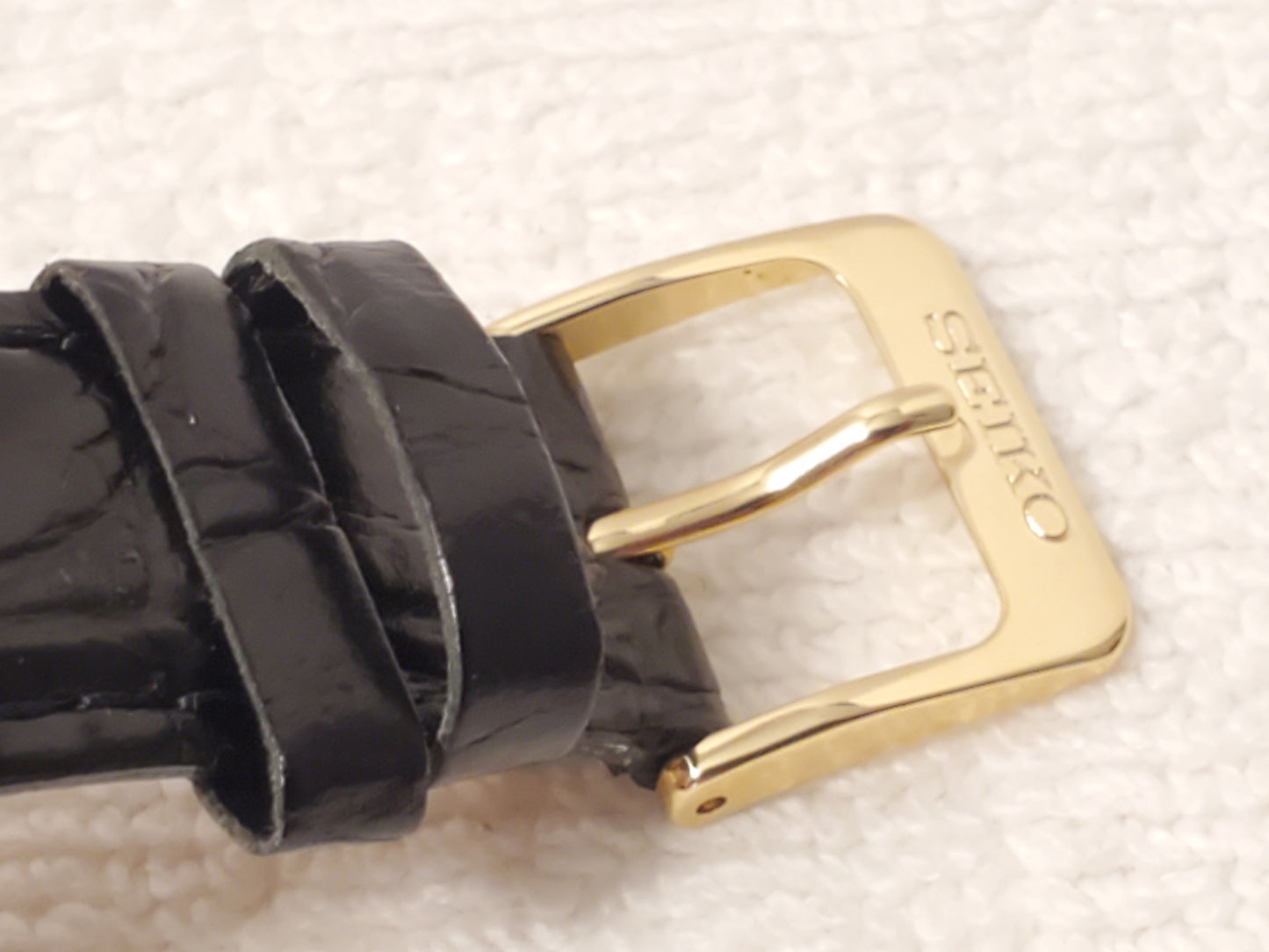 Vintage Seiko Men's Gold Tone Watch White Dial Roman Numerals Black Leather Band