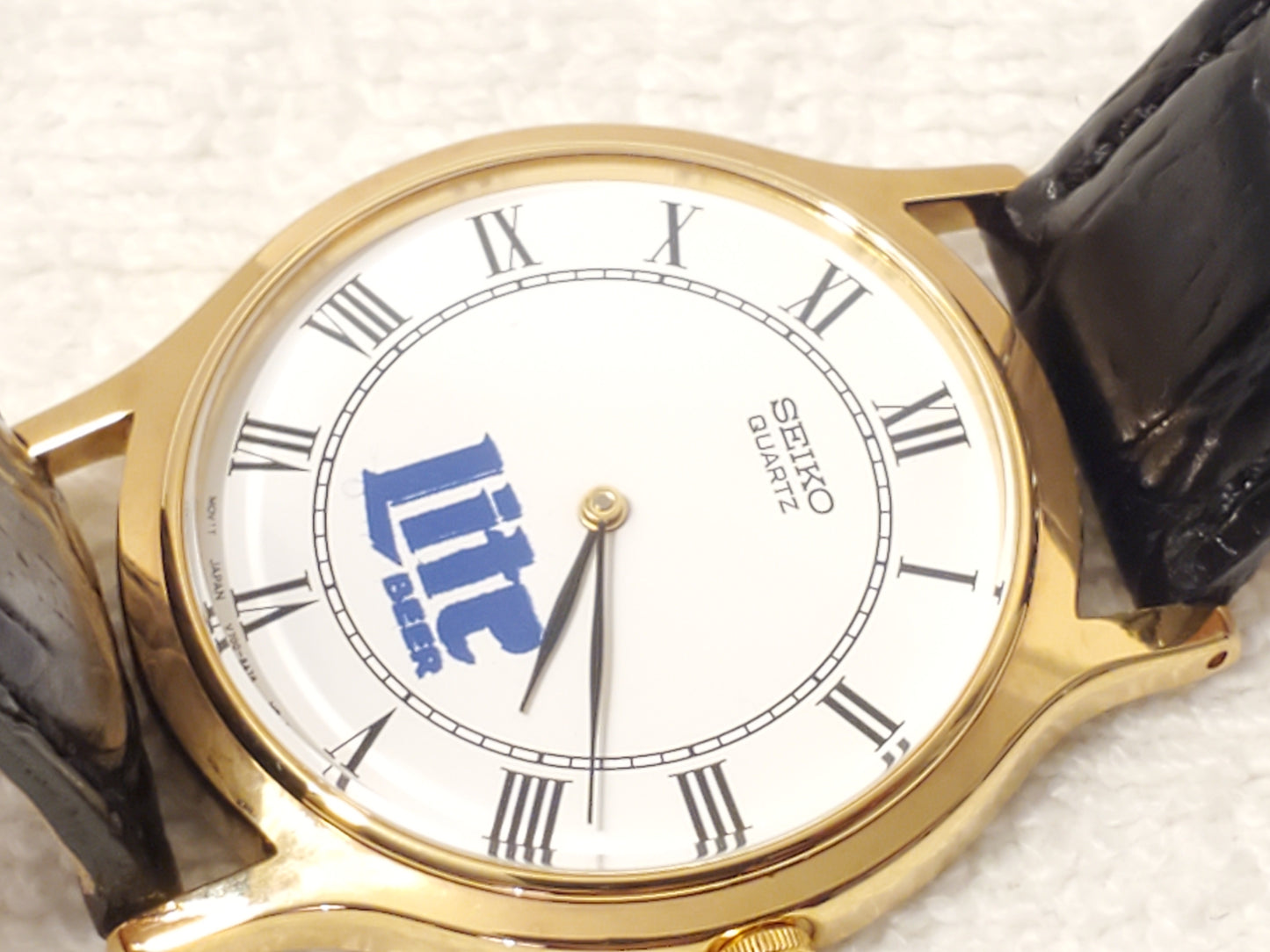 Vintage Seiko Men's Gold Tone Watch White Dial Roman Numerals Black Leather Band