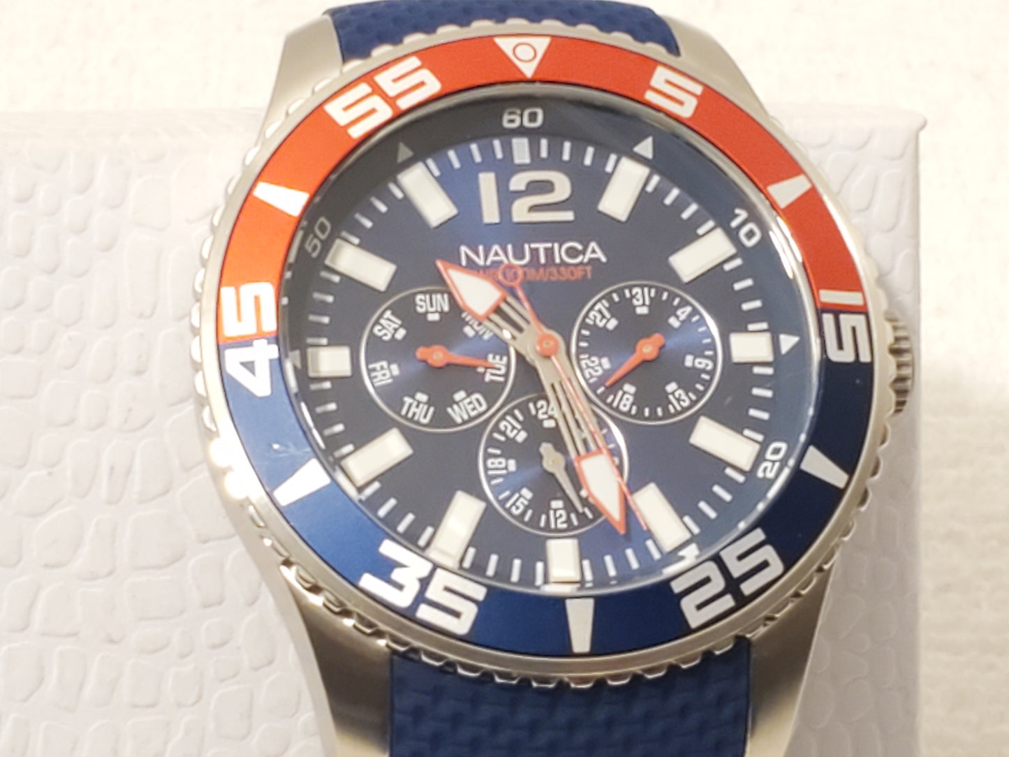 Nautica Red Blue Bezel Men's Day Date Quartz Watch Stainless Steel WR 100 Meters