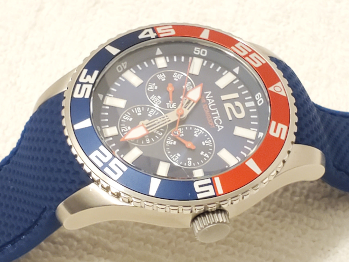 Nautica Red Blue Bezel Men's Day Date Quartz Watch Stainless Steel WR 100 Meters