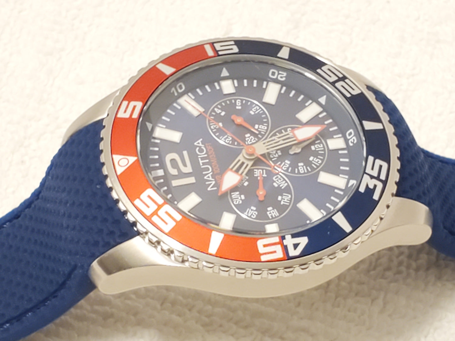 Nautica Red Blue Bezel Men's Day Date Quartz Watch Stainless Steel WR 100 Meters