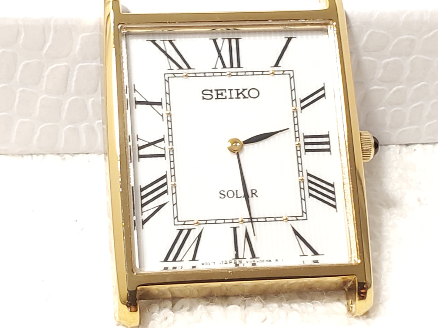 Seiko Solar Men's Tank Gold Tone Watch White Dial Black Roman Numerals S Steel