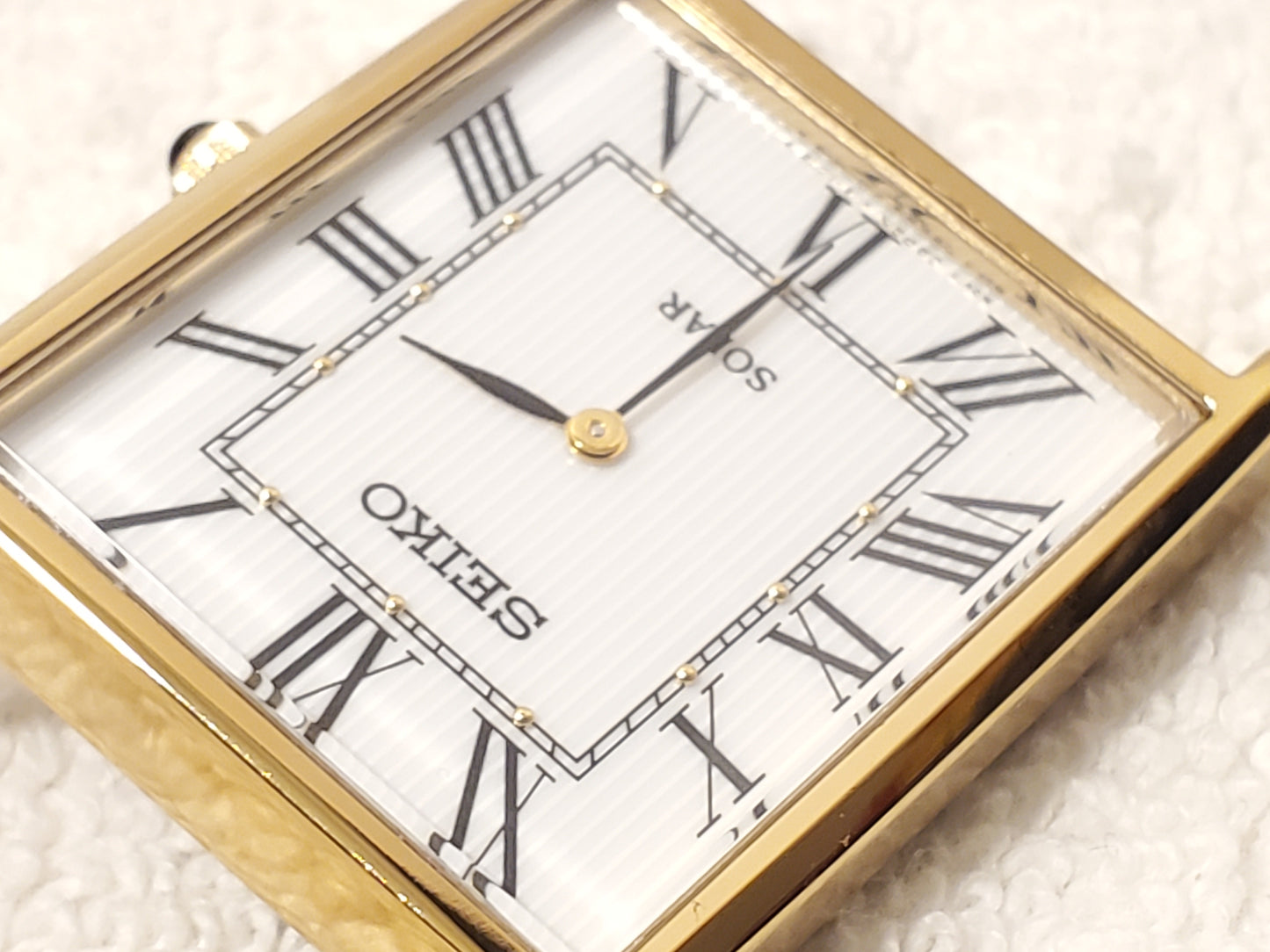 Seiko Solar Men's Tank Gold Tone Watch White Dial Black Roman Numerals S Steel