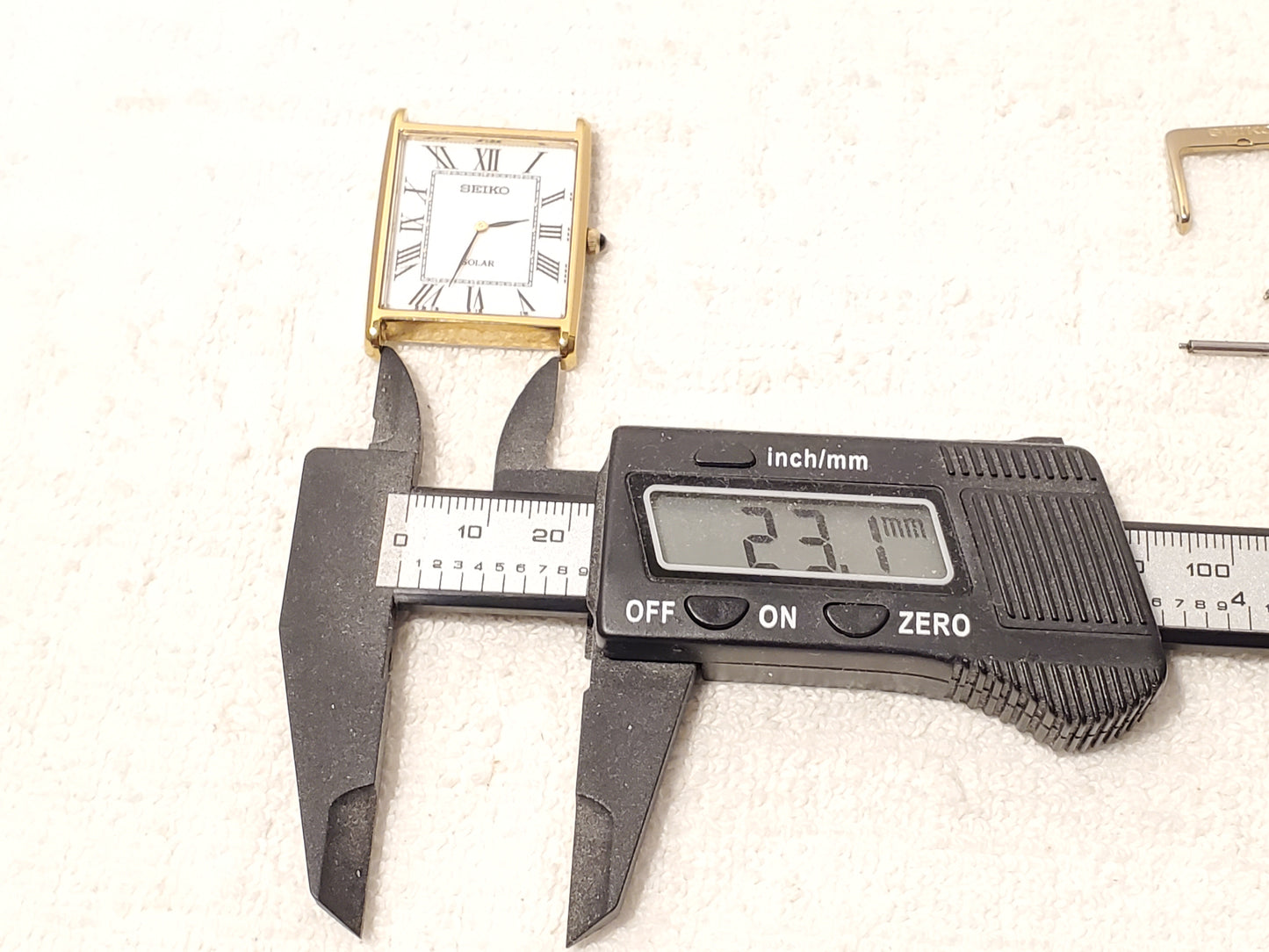 Seiko Solar Men's Tank Gold Tone Watch White Dial Black Roman Numerals S Steel