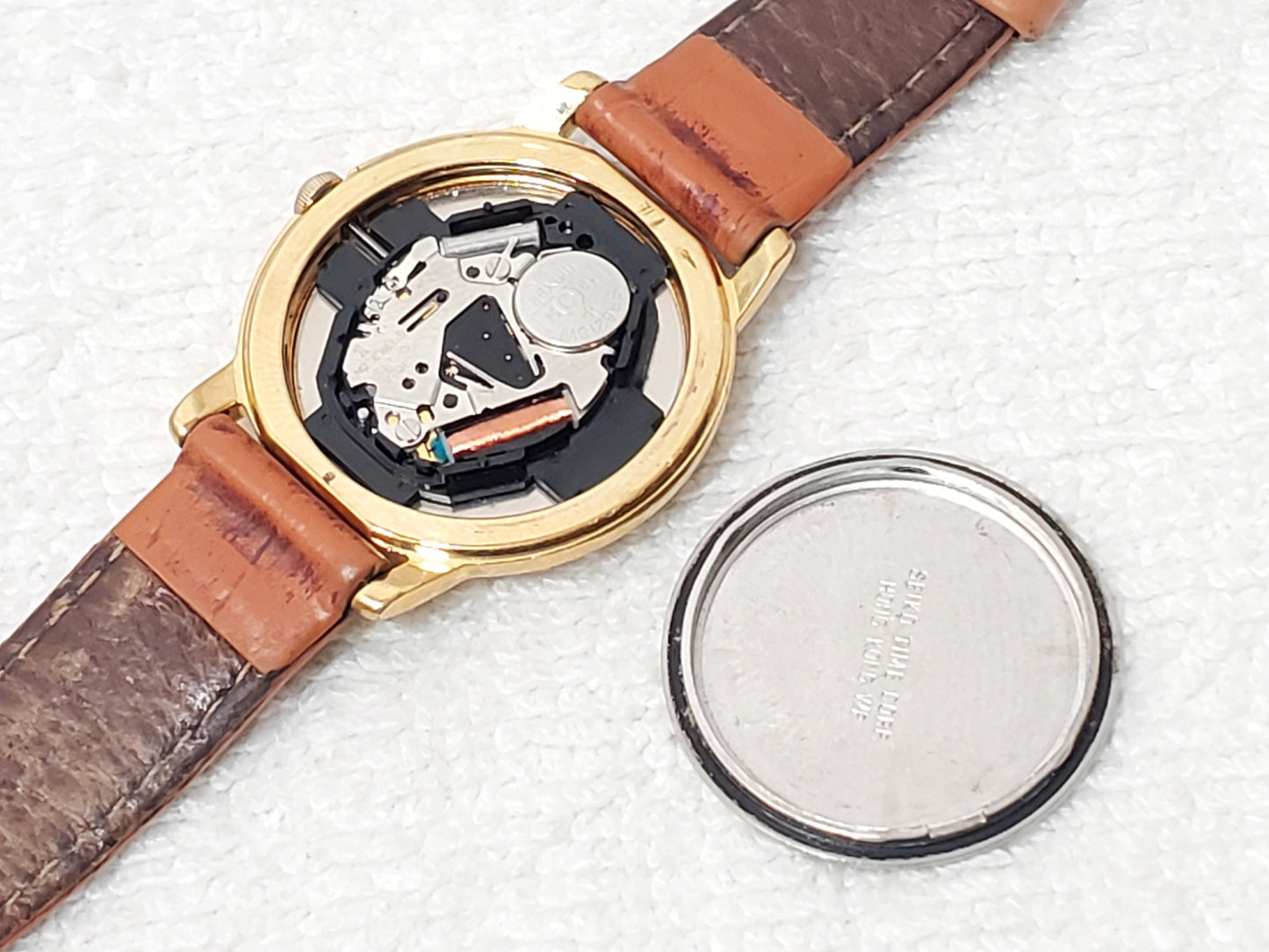 Vintage Seiko Women Gold Tone Watch White Dial Black Roman Numerals Leather Band