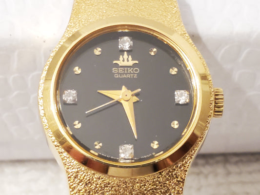 Vintage Seiko Womens Gold Tone Watch Black Dial Four Diamonds S Steel Base Metal