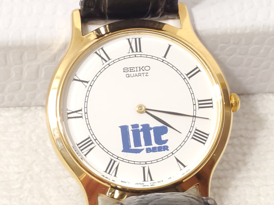 Vintage Seiko Men's Gold Tone Watch White Dial Roman Numerals Black Leather Band