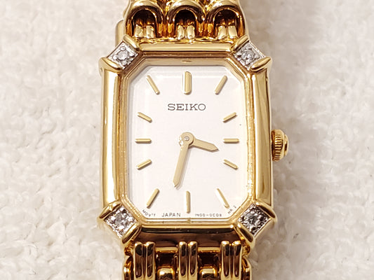 Vintage Seiko Women's Gold Tone Quartz Watch Four Diamonds Bezel White Dial