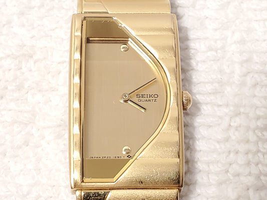 Vintage Seiko Half Moon Gold Tone Womens Quartz Watch Two Jewels Stainless Steel