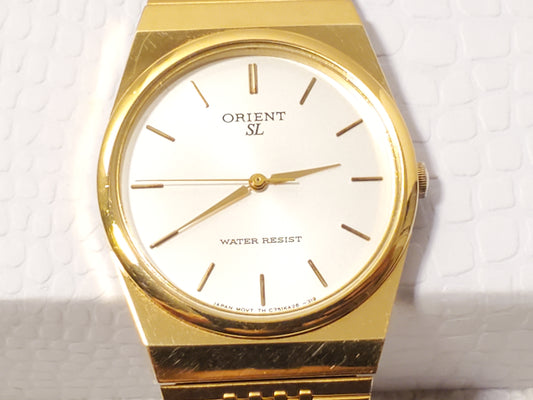 Vintage Orient Mens Gold Tone Quartz Watch Silver Dial Stainless Steel One Jewel