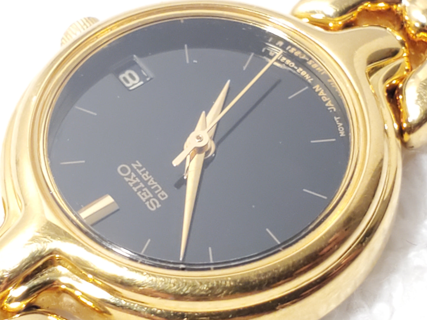 Vintage Seiko Women's Gold Tone Date Quartz Watch Black Dial Base Metal S Steel