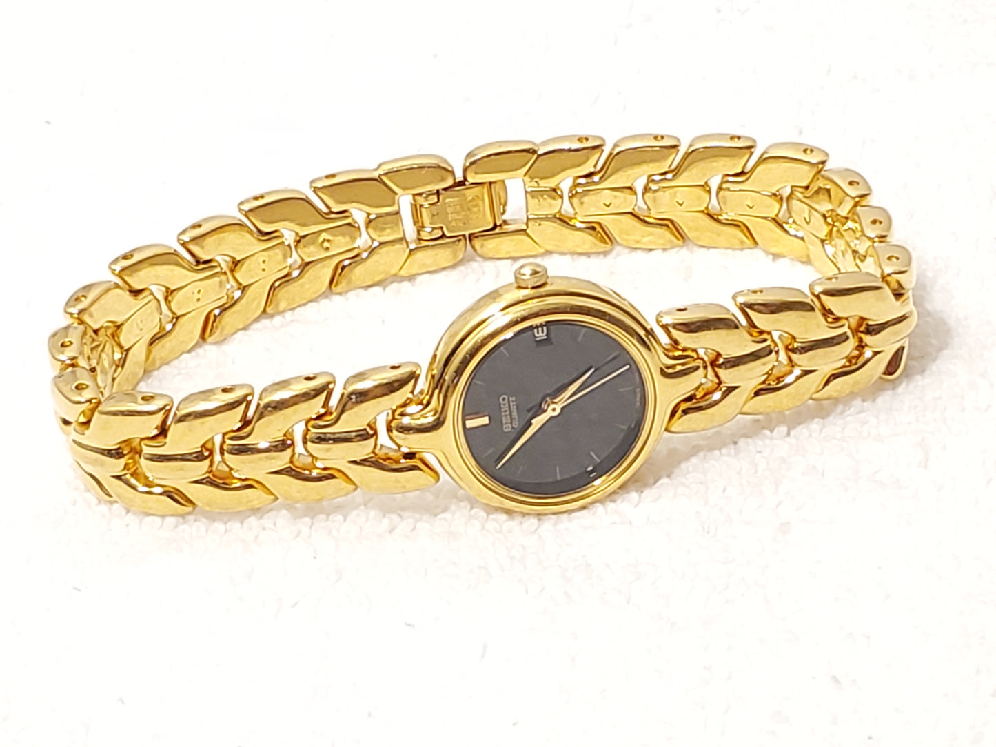 Vintage Seiko Women's Gold Tone Date Quartz Watch Black Dial Base Metal S Steel