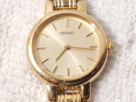 Vintage Seiko Women Gold Tone Stainless Steel Petite Quartz Watch Champagne Dial