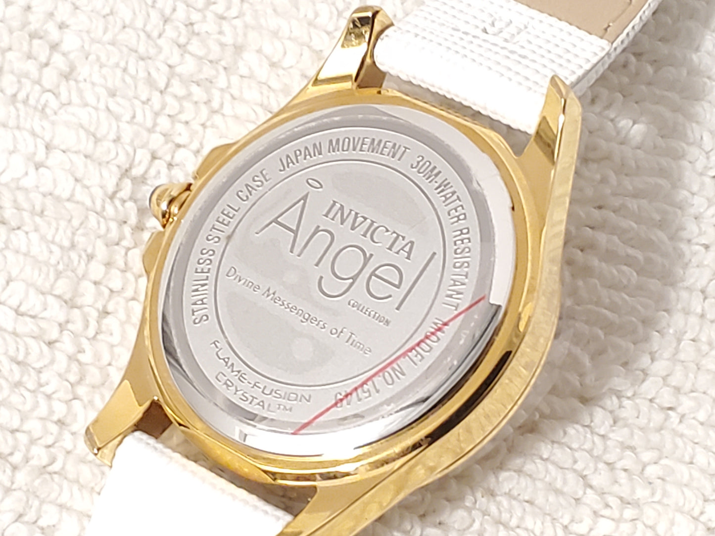 Invicta Angel Women's Quartz Watch Gold Tone White Leather Strap Blue Stone
