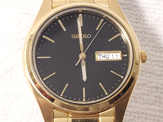 Vintage Seiko Men's Day Date Gold Tone Watch One Jewel Black Dial Flex Band SS