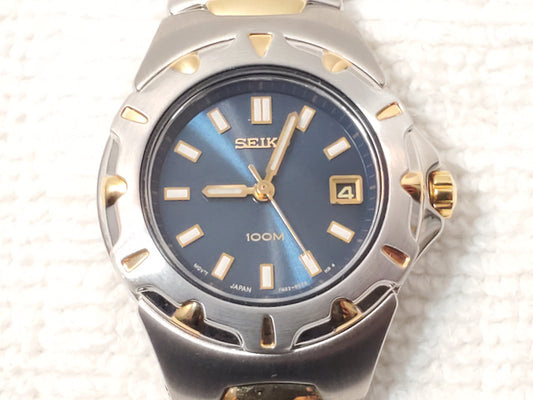 Vintage Seiko Gold Tone Stainless Steel Blue Dial Date Women Watch WR 100 Meters
