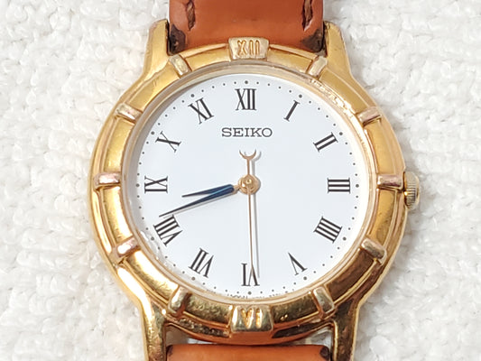 Vintage Seiko Women Gold Tone Watch White Dial Black Roman Numerals Leather Band