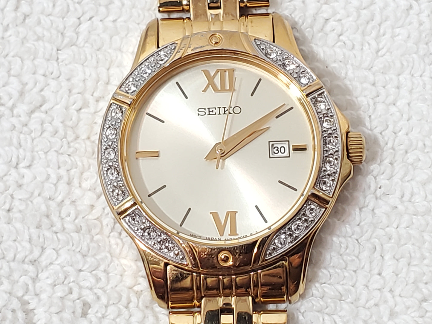 Seiko Women’s Date Quartz Watch Swarovski Crystal Gold Tone Roman Numerals