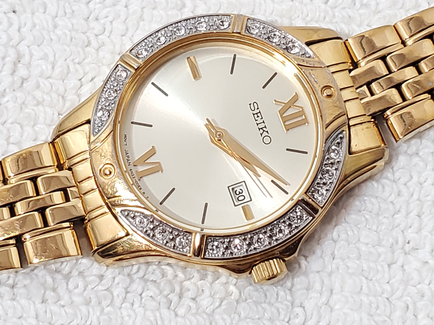 Seiko Women’s Date Quartz Watch Swarovski Crystal Gold Tone Roman Numerals