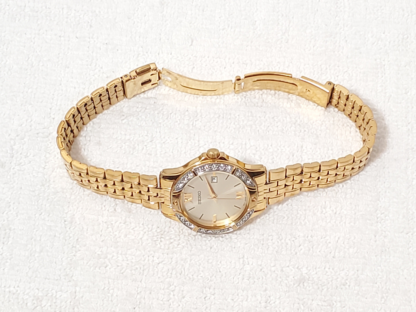 Seiko Women’s Date Quartz Watch Swarovski Crystal Gold Tone Roman Numerals