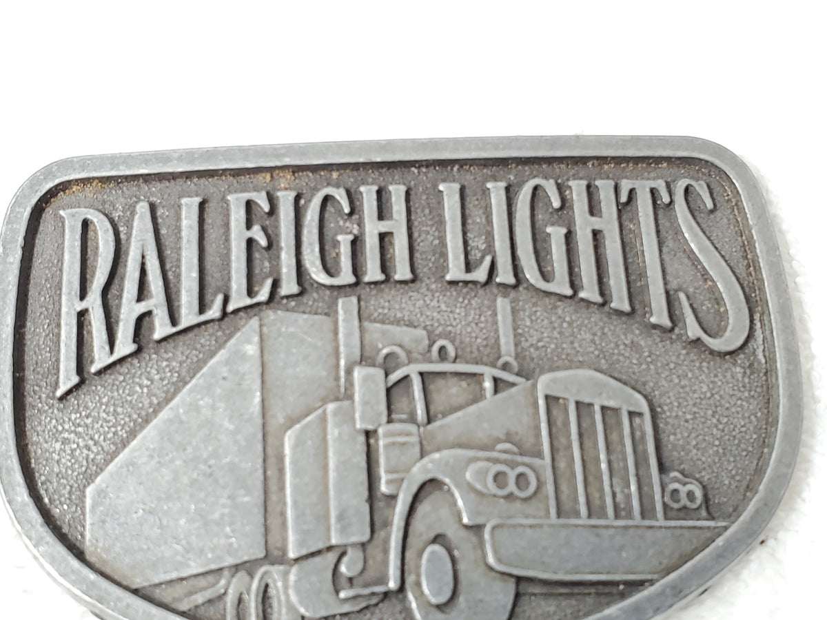 Vintage Raleigh Lights Semi Truck Tractor Trailer Promotional Belt Buckle
